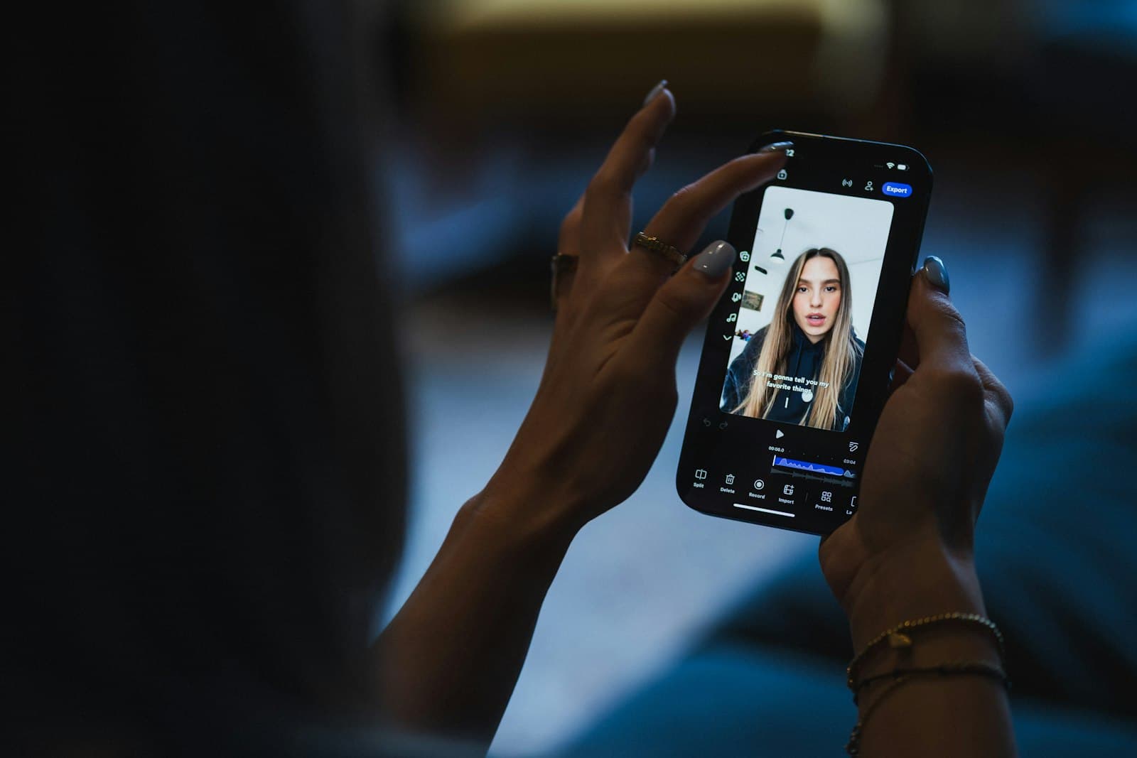 Person watching a vertical reel on an iPhone